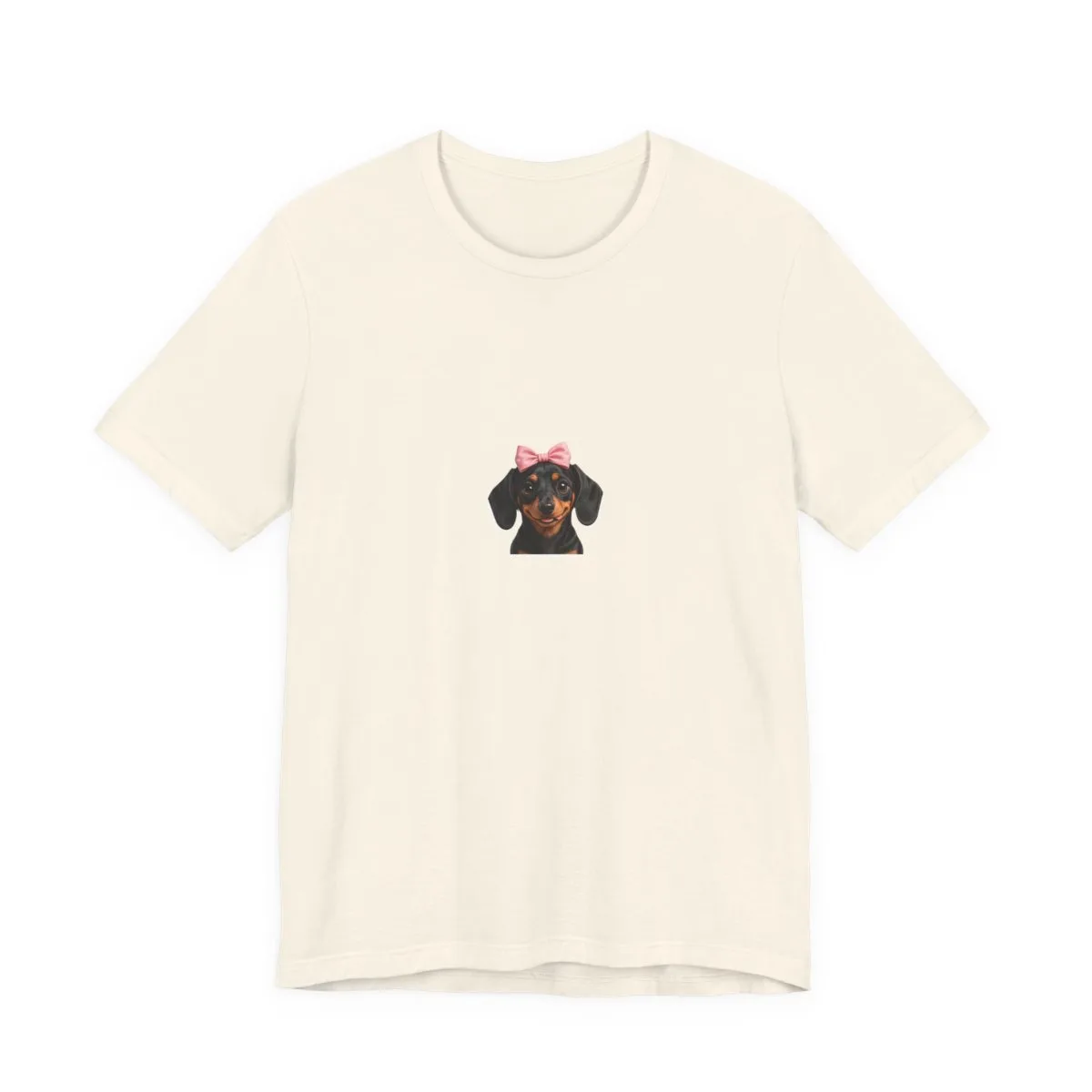 A small chest-sized mark of Luna in her bow — the illustration printed on this tee