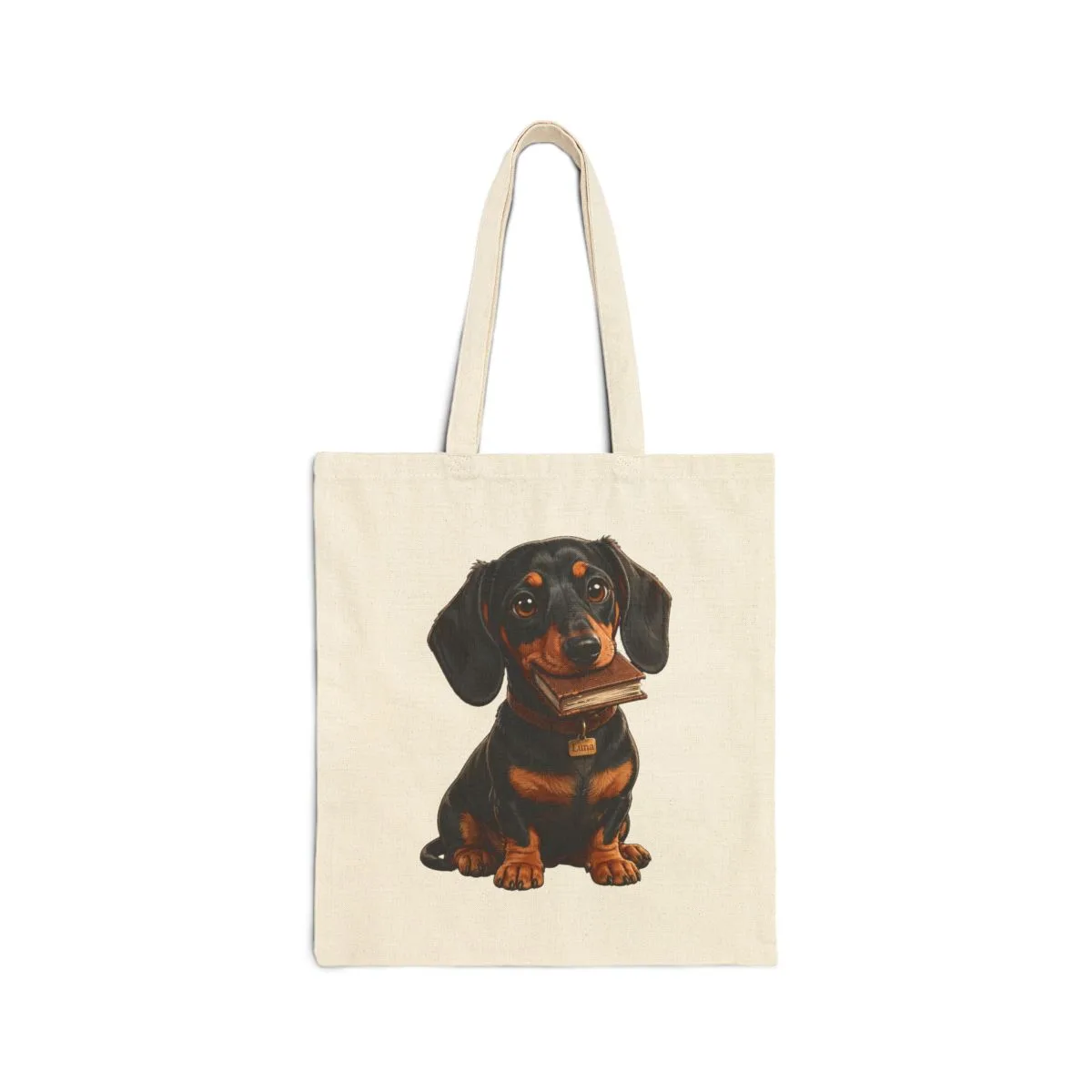 Luna curled beside an open book — the illustration printed on this tote