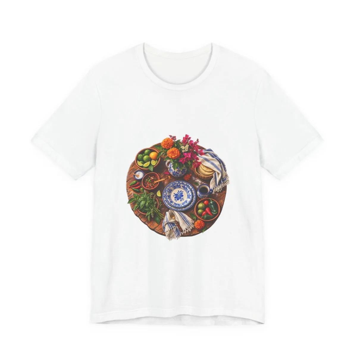 An old family table with blue-and-white plates, marigolds and bougainvillea, painted for this tee