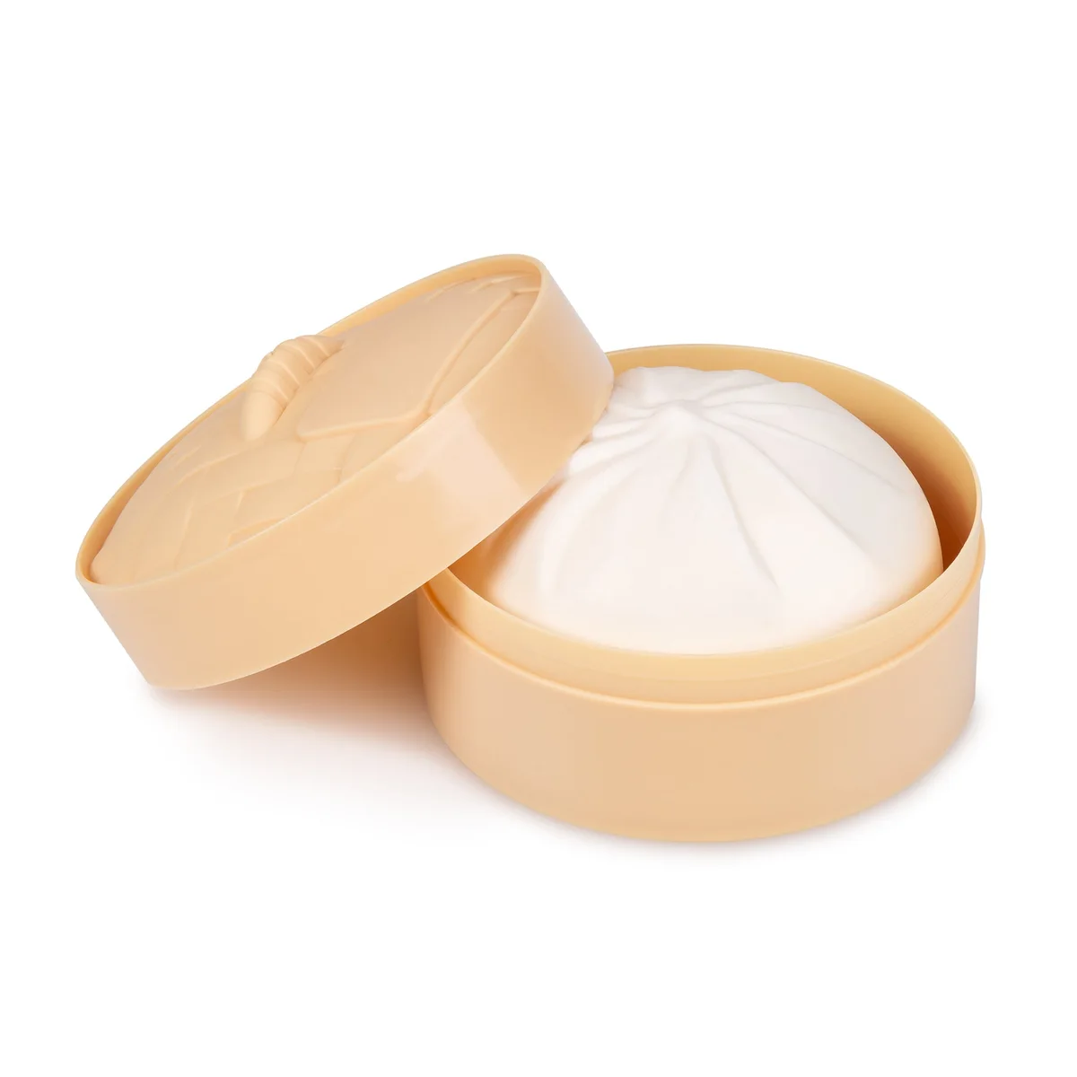 Supplier photograph: the white dumpling in its steamer-basket box, lid resting open